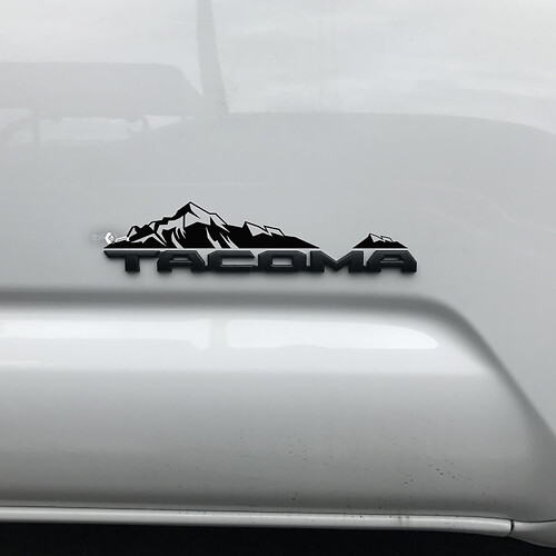 Toyota Tacoma bergen sticker over badge
 1