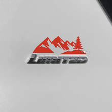 Bergen bomen sticker sticker over Toyota 4Runner Limited badge
 2