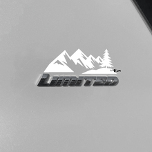 Bergen bomen sticker sticker over Toyota 4Runner Limited badge
 3