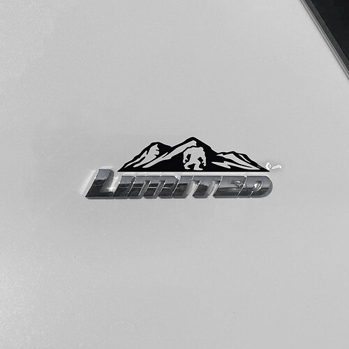 Bergen bomen sticker sticker over Toyota 4Runner Limited badge
