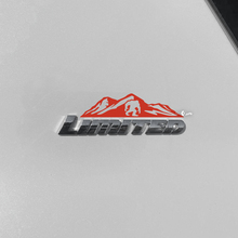 Bergen bomen sticker sticker over Toyota 4Runner Limited badge
 2
