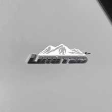 Bergen bomen sticker sticker over Toyota 4Runner Limited badge
 3