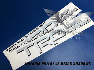 Paar TRD Super Charged Silver Chrome-spiegels met Black Shadows Toyota Racing Development vrachtwagenstickers aan bedzijde
 1